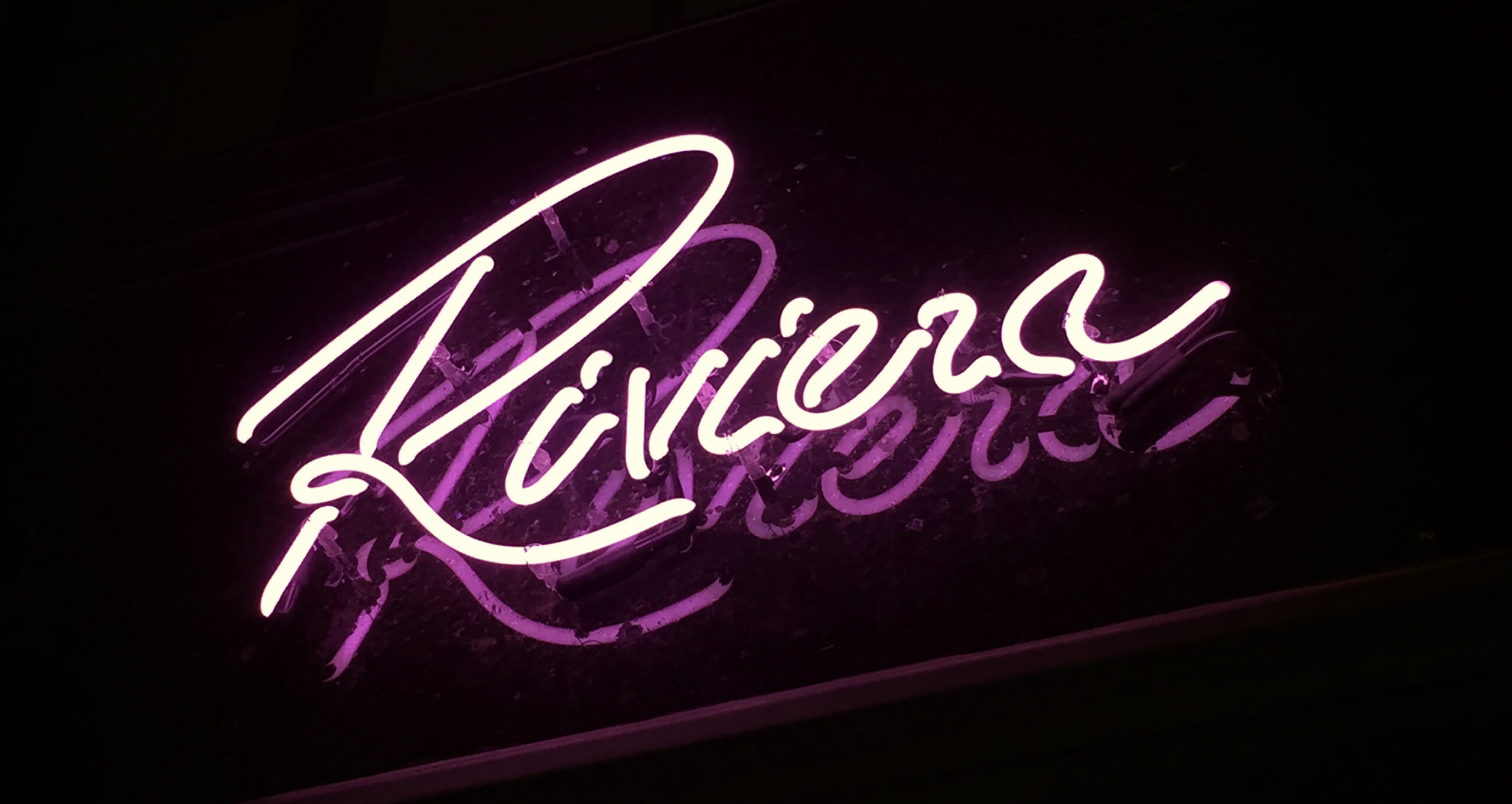 Close up of Riviera neon logo sign. 
