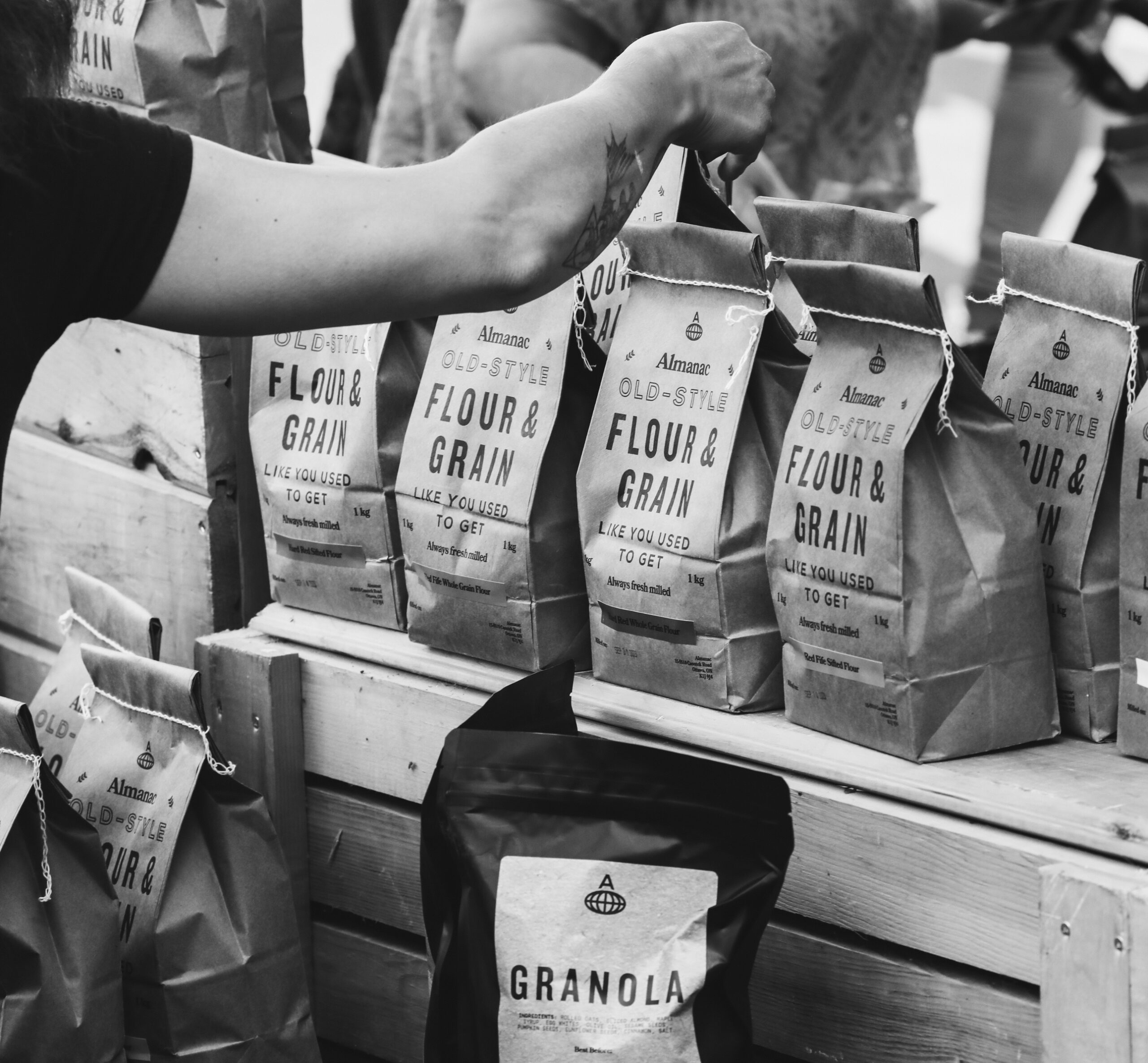 Black and white photo of Almanac flour bags